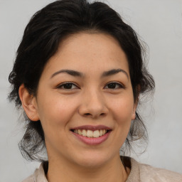 Joyful asian young-adult female with medium  brown hair and brown eyes