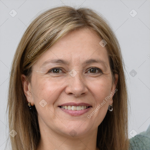 Joyful white adult female with long  brown hair and grey eyes