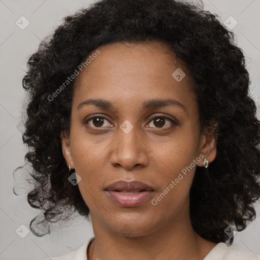 Joyful black young-adult female with medium  black hair and brown eyes