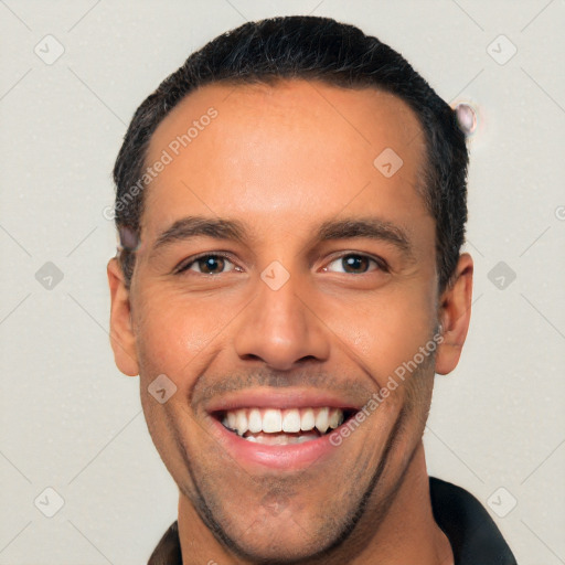 Joyful white young-adult male with short  black hair and brown eyes