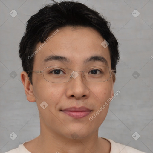 Joyful asian young-adult male with short  brown hair and brown eyes