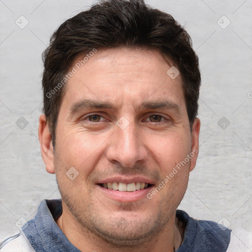 Joyful white adult male with short  brown hair and grey eyes