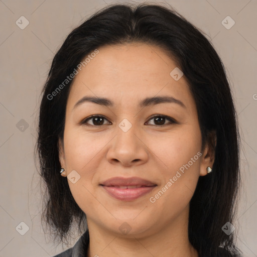 Joyful latino young-adult female with medium  brown hair and brown eyes