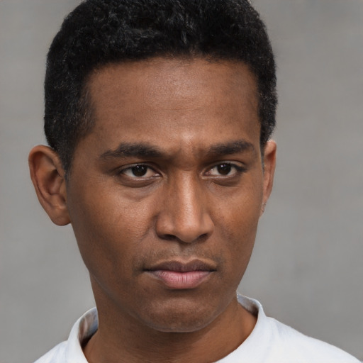Neutral latino young-adult male with short  black hair and brown eyes