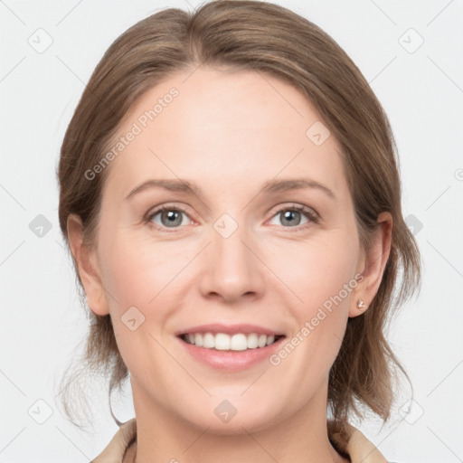 Joyful white young-adult female with medium  brown hair and grey eyes