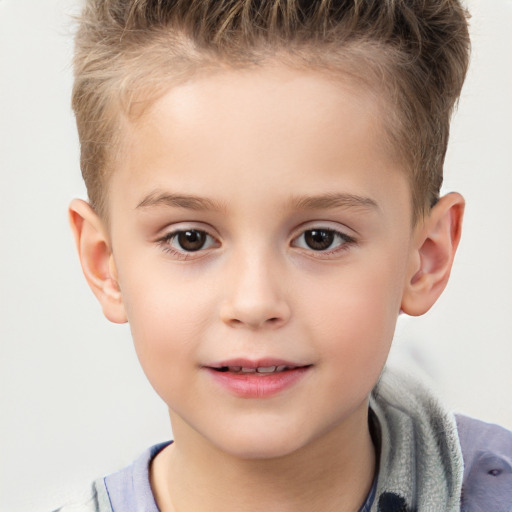 Joyful white child male with short  brown hair and brown eyes