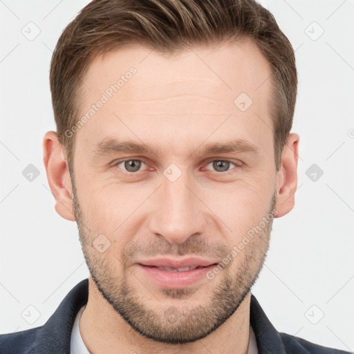 Joyful white young-adult male with short  brown hair and grey eyes