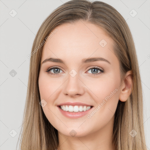 Joyful white young-adult female with long  brown hair and grey eyes