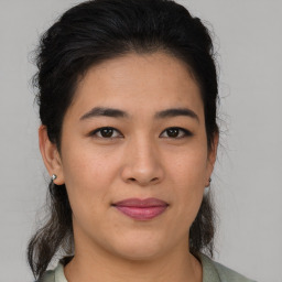 Joyful asian young-adult female with medium  brown hair and brown eyes