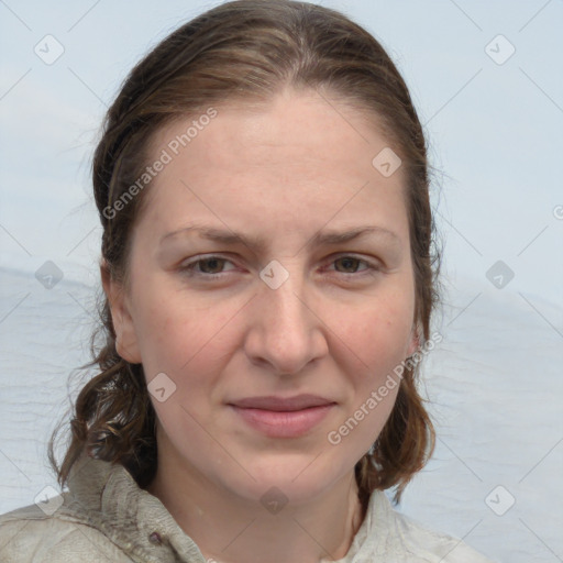 Joyful white adult female with medium  brown hair and blue eyes