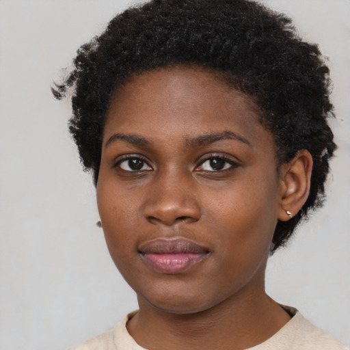 Neutral black young-adult female with short  brown hair and brown eyes
