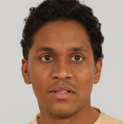 Neutral black young-adult male with short  brown hair and brown eyes