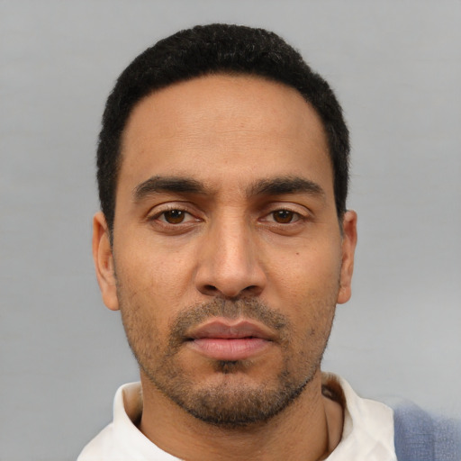 Neutral latino young-adult male with short  black hair and brown eyes