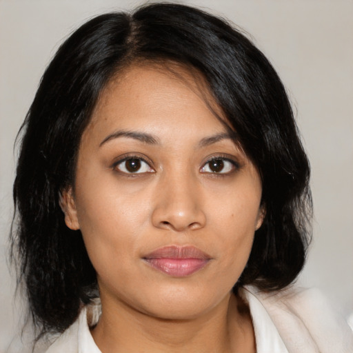 Neutral latino young-adult female with medium  brown hair and brown eyes
