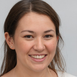 Joyful white young-adult female with medium  brown hair and brown eyes