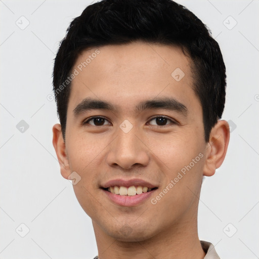 Joyful latino young-adult male with short  black hair and brown eyes