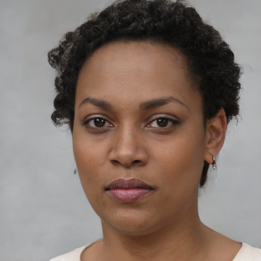 Neutral black young-adult female with short  black hair and brown eyes