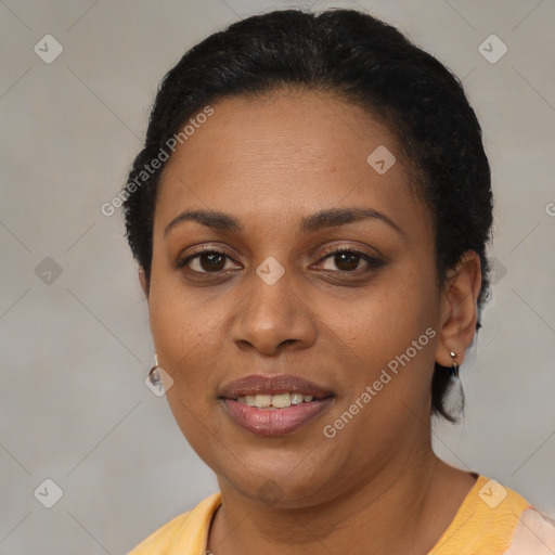 Joyful black adult female with short  brown hair and brown eyes