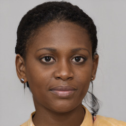 Joyful black young-adult female with medium  brown hair and brown eyes