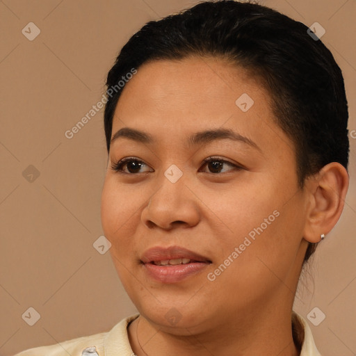 Joyful latino young-adult female with short  brown hair and brown eyes
