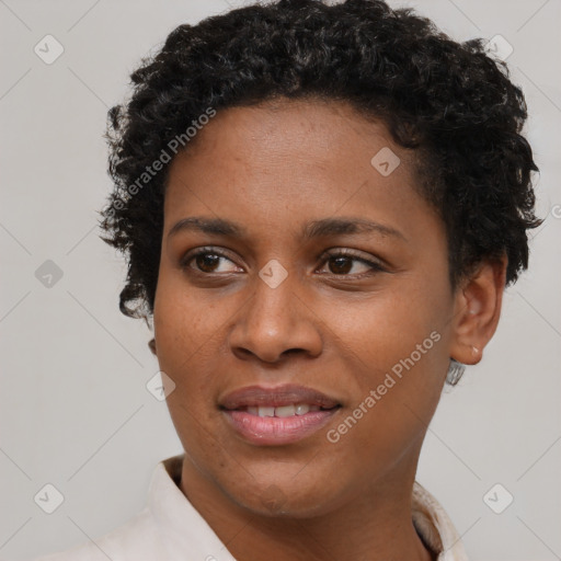 Joyful black young-adult female with short  brown hair and brown eyes