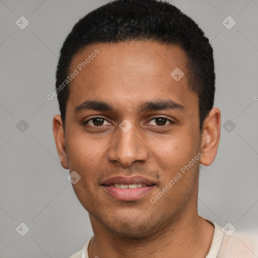 Joyful black young-adult male with short  brown hair and brown eyes