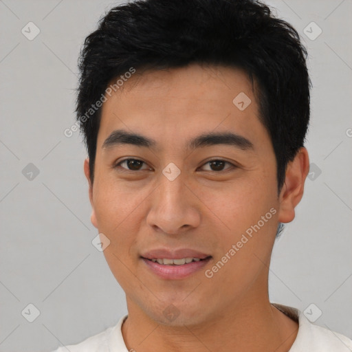 Joyful asian young-adult male with short  black hair and brown eyes