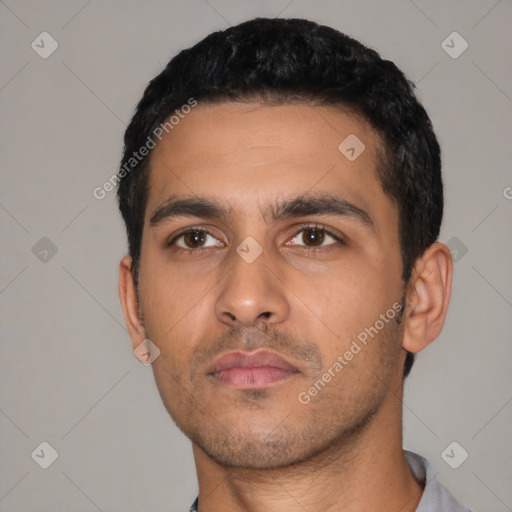 Neutral latino young-adult male with short  black hair and brown eyes