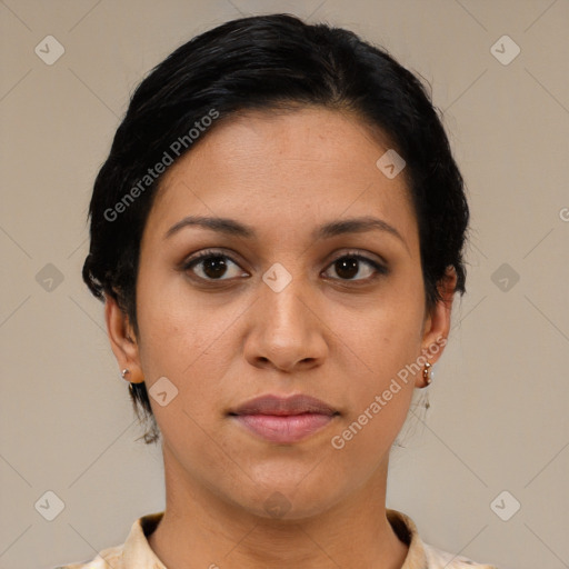 Joyful latino young-adult female with short  black hair and brown eyes