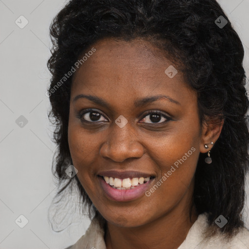 Joyful black young-adult female with long  brown hair and brown eyes