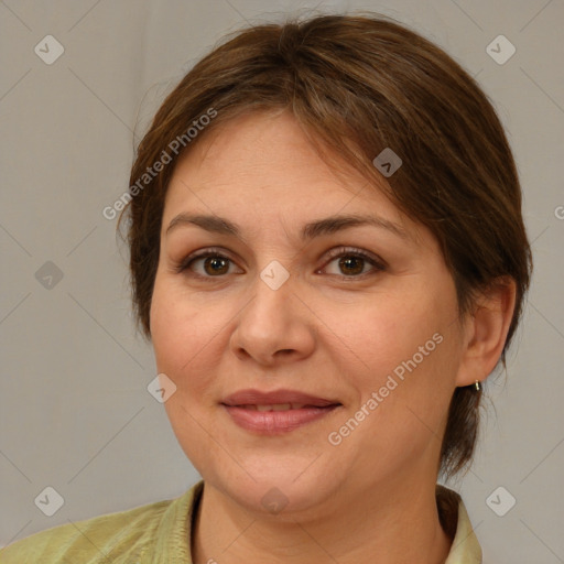 Joyful white adult female with medium  brown hair and brown eyes