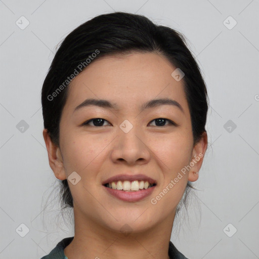 Joyful asian young-adult female with medium  black hair and brown eyes