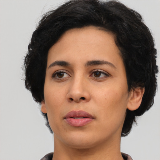 Neutral latino young-adult female with short  black hair and brown eyes