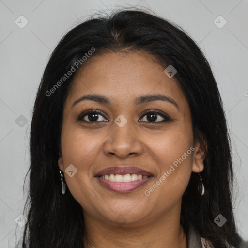 Joyful black young-adult female with long  brown hair and brown eyes