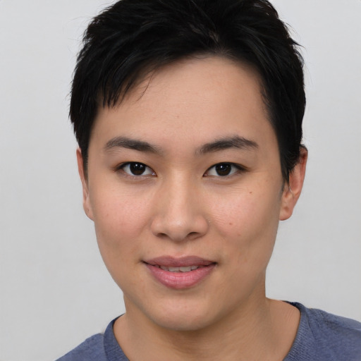 Joyful asian young-adult female with short  brown hair and brown eyes