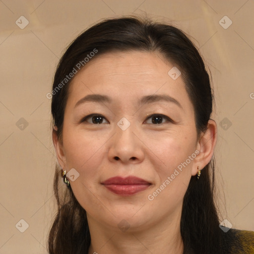 Joyful white adult female with medium  brown hair and brown eyes