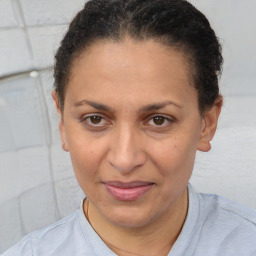 Joyful white adult female with short  brown hair and brown eyes