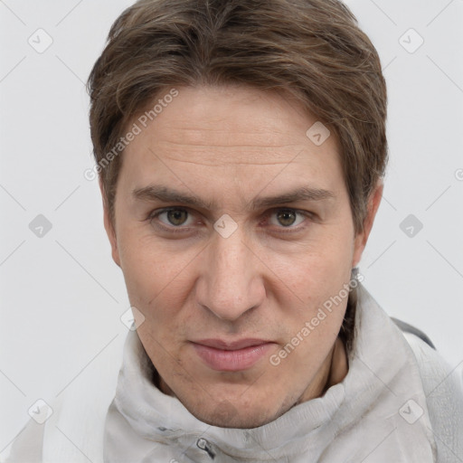 Joyful white adult male with short  brown hair and grey eyes