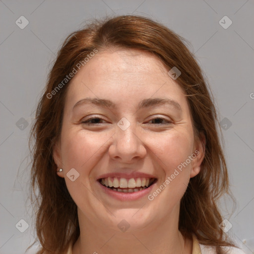 Joyful white adult female with medium  brown hair and grey eyes