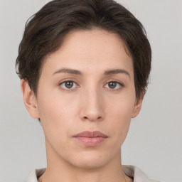 Neutral white young-adult female with short  brown hair and brown eyes