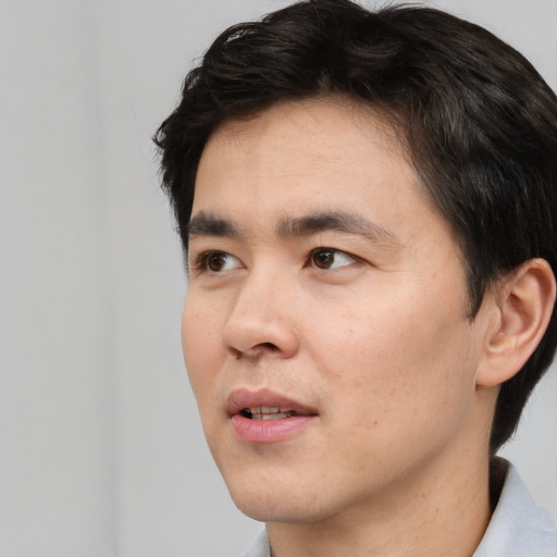 Neutral white young-adult male with short  black hair and brown eyes