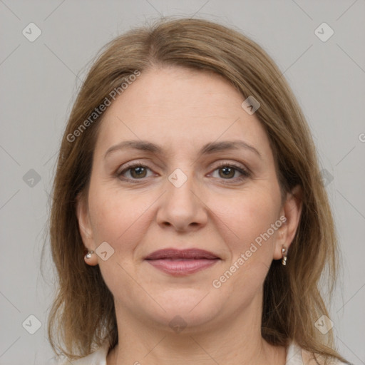 Joyful white adult female with medium  brown hair and grey eyes