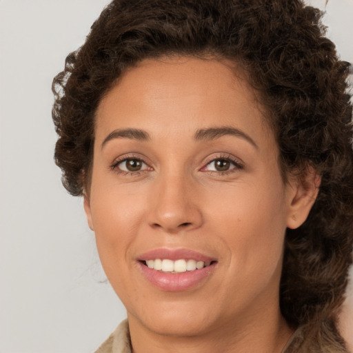 Joyful white young-adult female with medium  brown hair and brown eyes