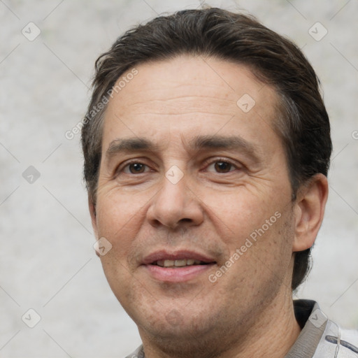 Joyful white adult male with short  brown hair and brown eyes