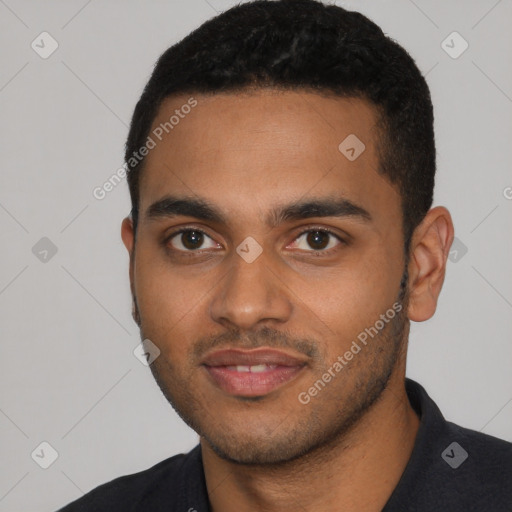 Joyful black young-adult male with short  black hair and brown eyes