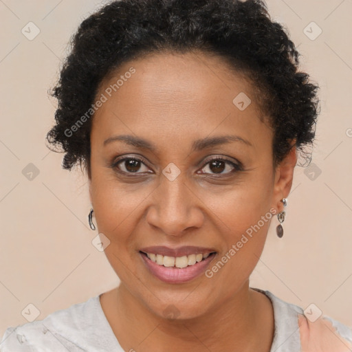 Joyful black adult female with short  brown hair and brown eyes