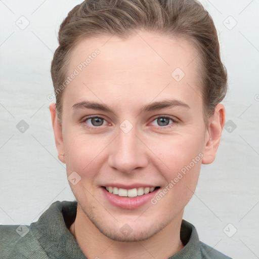 Joyful white young-adult female with short  brown hair and grey eyes