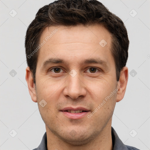 Joyful white adult male with short  brown hair and brown eyes