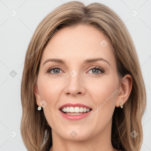 Joyful white young-adult female with long  brown hair and green eyes