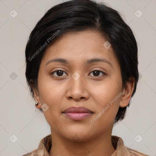 Joyful latino young-adult female with medium  brown hair and brown eyes